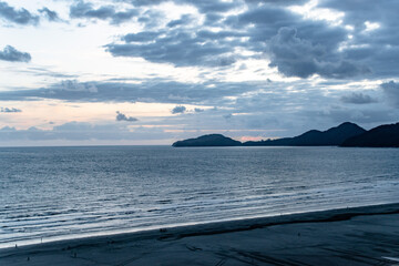 Wall Mural - Dark Cloudy Beach and Ocean at Sunset in Santos Sao Paolo Brazil