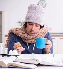 Wall Mural - Sick male student suffering at home