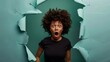 Photo of surprised Afro woman in black t shirt gasps from amazement looks with scared face expression aside dressed in black t shirt unexpected to see something horrible poses in torn  : Generative AI