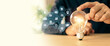 © Eakrin - Hand choose light bulb with bright light and business plan icons for creative idea innovation of technology in analyzing global marketing online data management services to target growth concept.