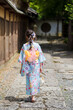 Japanese girl in a kimono Yukata walking on the stone road in Kyoto, Japan.