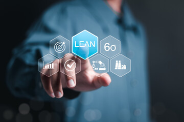 Lean manufacturing and six sigma management. Person touching lean word on virtual screen for quality standard in industry, continuous improvement, reduce waste, improve productivity and efficiency.