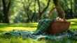 Sunlit picnic setting with empty wicker basket and vibrant green plaid cloth
