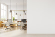 Modern white coworking office interior with blank wall