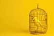 Yellow canary locked in a golden cage on a yellow background