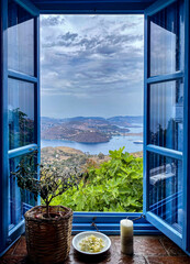 Wall Mural - Blue window with a view on Skala