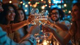 Fototapeta  - group of young socialites out to dinner at night having a toast with champagne 
