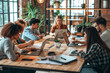 © koala studio - Group of People Working on Laptops at Table