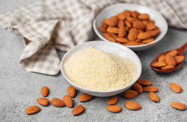 Wall Mural - Fresh almond flour in a  bowl and almonds