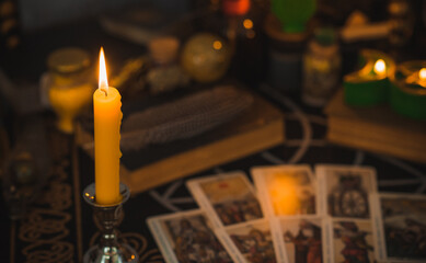 Altar of modern witch. Candles and oracle stuff on a table. Mental work with energetic. Some rite and fate prediction illustration