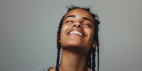 Aufkleber - A picture of a woman with a smiling expression and braided hair. Suitable for various uses