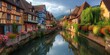 France. Small waterway and classic timbered homes.
