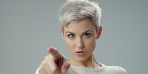 Aufkleber - A woman pointing her finger directly at the camera. Perfect for advertising and promotional materials