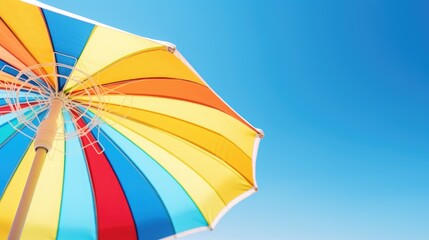 Poster - Multicolored umbrella against clear blue sky. Perfect for weather or travel concepts