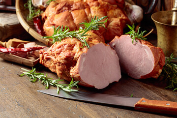 Wall Mural - Smoked ham on an old wooden table.