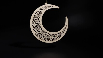 Wall Mural - Ramadan Kareem moon swinging on black background, Islamic celebration, vintage decoration, traditional culture