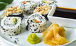 Sushi Roll Platter on white plate. Salmon sushi set, serving food for restaurant, menu, advert or package, close up, selective focus