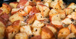 Roasted potato background. Homemade cooking fresh baked potato pattern, serving food for restaurant, menu, advert or package, close up, selective focus