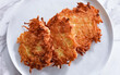 Potato pancakes on plate. Latkes, flapjacks potato for restaurant, menu, advert or package, close up, selective focus
