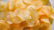 Potato Chips Crinkle Snack background pattern. Homemade potato chips for restaurant, menu, advert or package, close up, selective focus