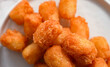 Fried Potato Sticks Crinkle, cutout minimal on white plate. Homemade potato snack for sale, package, advert, close up, selective focus