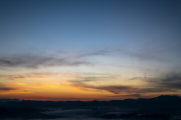 Wall Mural - Beautiful skyline in sunrise over mountains