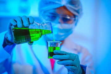 Female scientist diligently conducts virus blood lab tests, contributing to critical research and advancements in the field of virology.