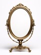 a gold oval mirror with a white background