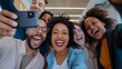 Office selfie. Friendly young biracial workers colleagues have fun at workplace shoot cute silly self picture on phone
