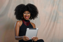  Woman Holding A Tablet Computer, Looking At The Camera, Black Woman