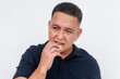 © Mdv Edwards - A middle aged asian man munches on a biscuit. Having a quick snack, posing on a white background.
