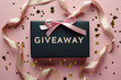 Promotional giveaway banner with pink and black ribbon