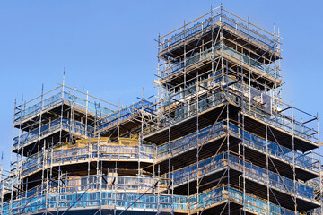 Wall Mural - Scaffolding surrounding residential development for safe access to construction work