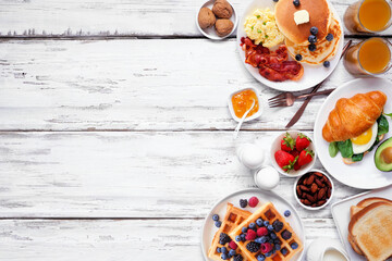Aufkleber - Breakfast or brunch side border on a white wood background. Top down view. Variety of sweet and savory food items.