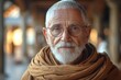 A genial priest with a grey beard and warm eyes, wearing a golden-brown shawl, exudes kindness in an ambiently lit sanctuary, his gaze inviting calm.