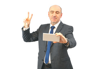 joyful man with a tablet showing two fingers up, victoria gesture. happy businessman holding touchpad isolated on  background. concept of online communication, negotiations