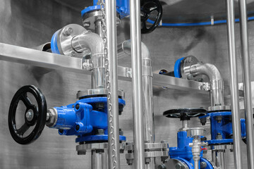 Poster - Pipes and taps in water supply boiler room, engineering industrial background