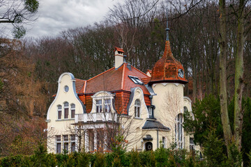 Wall Mural - Old mansion in the forest in spring	