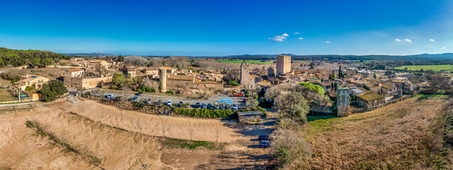 Wall Mural - Aerial view of Peratallada, historic artistic small fortified medieval town with castle  in Catalonia, Spain near the Costa Brava. Stone buildings rutted stone streets and passageways.