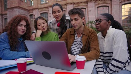 Group of students, high school pupils gather outdoors university campus work together on creative task, prepare for university test or exams use laptop. Education study tech project on digital display