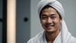 © Arceli - Portrait of smiling young asian man with white towel on head plain white background bright white studio lighting from Generative AI