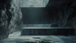 Monolithic concrete platform stands in a cavernous space, edged by rugged rock walls and highlighted by subtle lighting