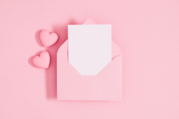 Canvas Print - Open pink envelope with paper card and heart on pastel pink table background. Birthday, Wedding, Mother's Day, Valentine's day, Women's Day. Flat lay, top view, copy space