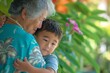 Tender Embrace Between Grandmother and Grandson in a Lush Garden in Hawaii 