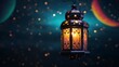 An illuminated colorful ramadan lantern against blue night sky with an crescent moon