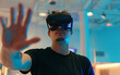 © Syed Qaseem Raza - handsome man in vr glasses, playing with virtual reality headset, trying to touch something with hand