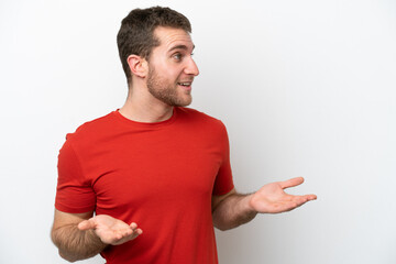 Wall Mural - Young caucasian man isolated on white background with surprise expression while looking side