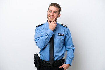 Wall Mural - Young police caucasian man isolated on white background thinking an idea while looking up