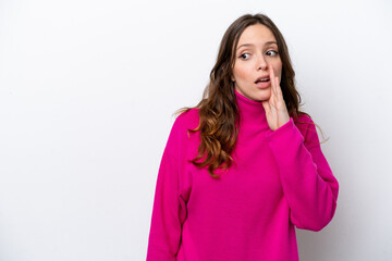 Wall Mural - Young caucasian woman isolated on white background whispering something with surprise gesture while looking to the side