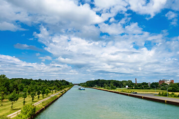 Canvas Print - Canal and clouds over the river
